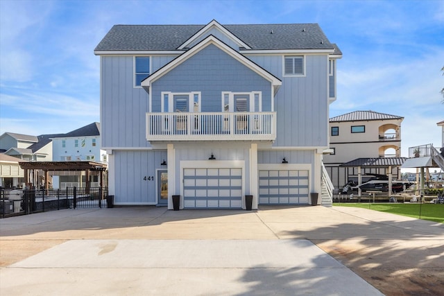 view of front of house with a balcony and a garage