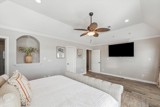 bedroom featuring hardwood / wood-style floors, ceiling fan, and ornamental molding