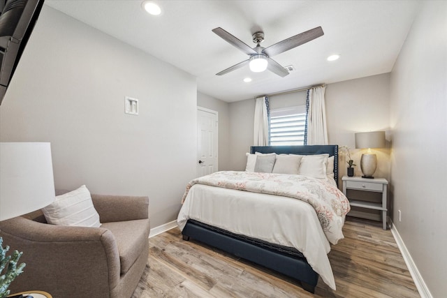 bedroom featuring ceiling fan and hardwood / wood-style floors