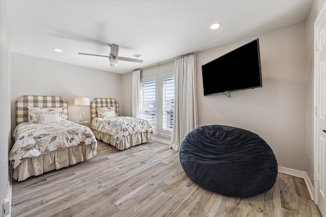 bedroom featuring ceiling fan and light hardwood / wood-style flooring