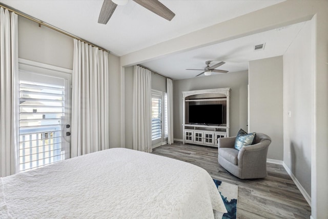 bedroom featuring ceiling fan and hardwood / wood-style flooring