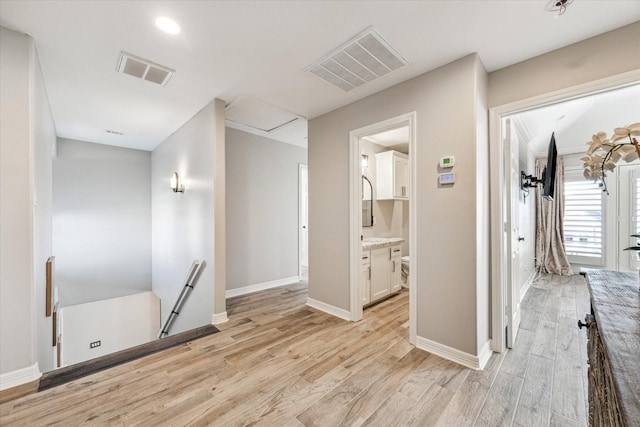 hall with light wood-type flooring