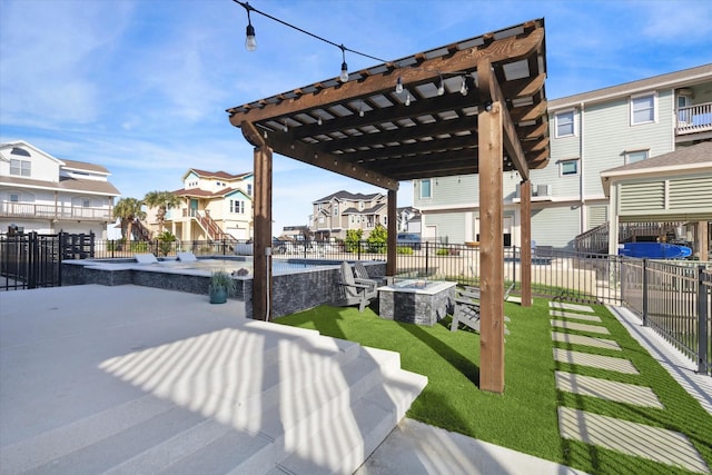 exterior space featuring a pergola, a patio area, and a fire pit