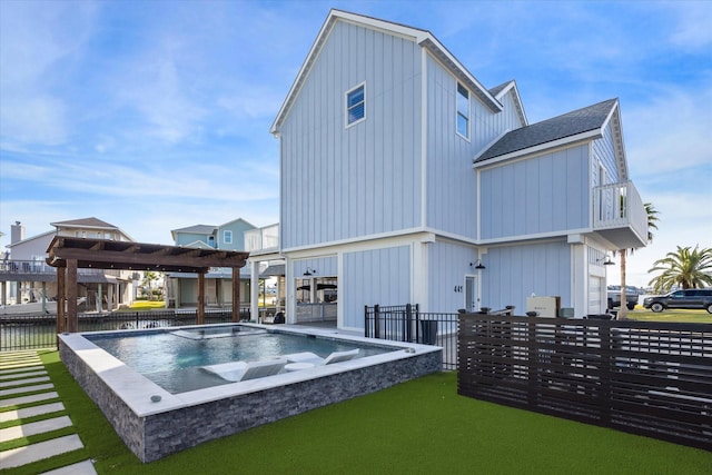 back of property with a pergola