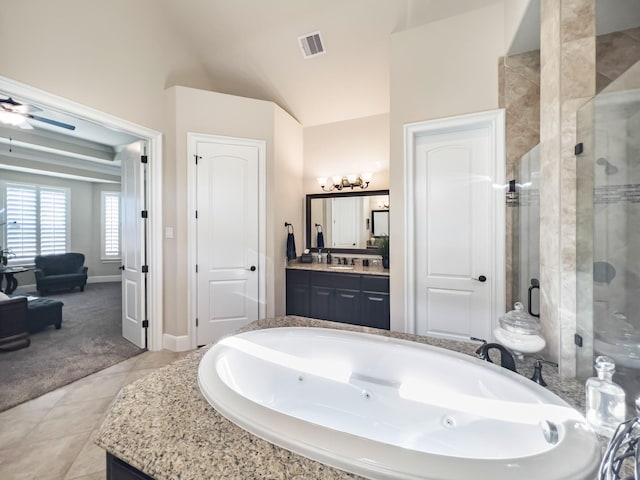 bathroom with ceiling fan, tile patterned flooring, separate shower and tub, vaulted ceiling, and vanity