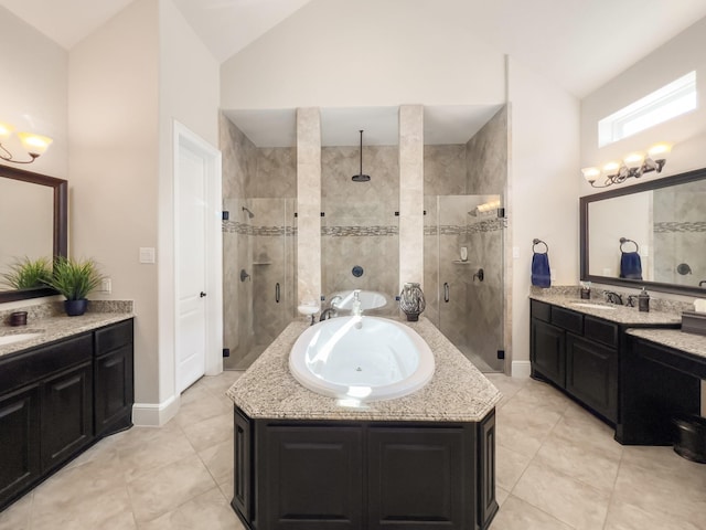 bathroom featuring tile patterned flooring, vanity, lofted ceiling, and independent shower and bath