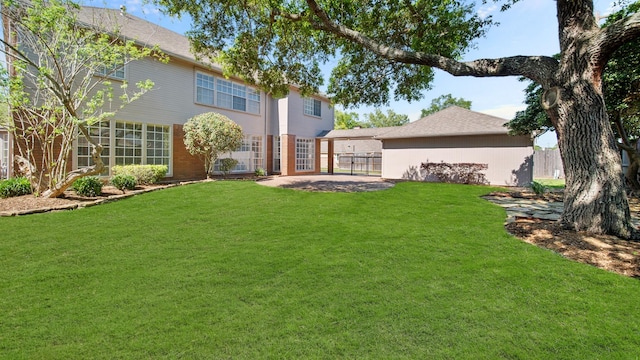 rear view of house with a lawn