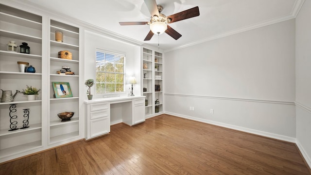 unfurnished office featuring ceiling fan, light hardwood / wood-style floors, and ornamental molding