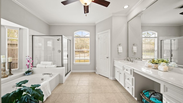 bathroom with tile patterned flooring, separate shower and tub, and a healthy amount of sunlight