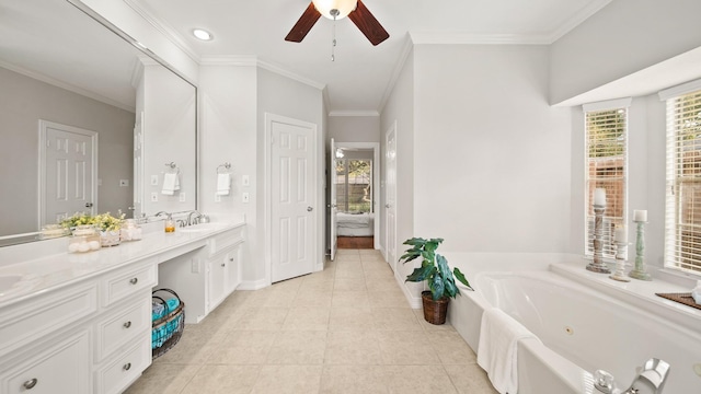 bathroom with tile patterned floors, vanity, ornamental molding, and a wealth of natural light