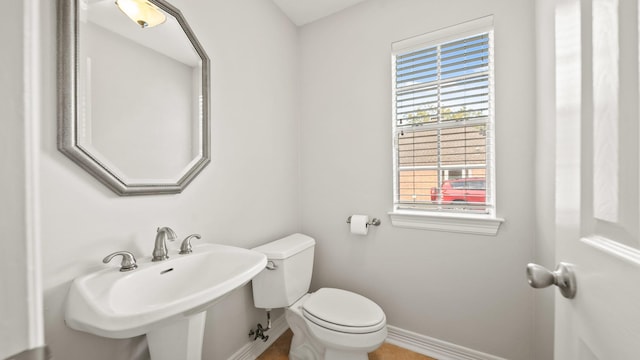 bathroom featuring sink and toilet