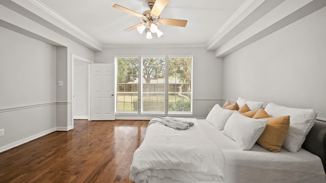 bedroom with dark hardwood / wood-style floors, ceiling fan, and crown molding