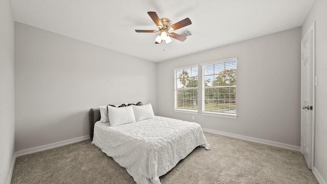 carpeted bedroom featuring ceiling fan