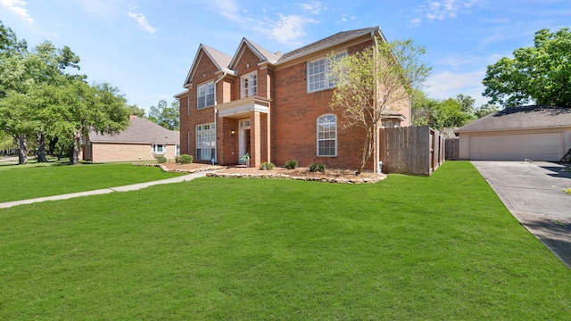 view of front of property with a front yard and a garage