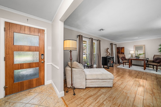 entryway with crown molding and light hardwood / wood-style flooring