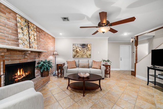 living room with ornamental molding, ceiling fan, and a fireplace