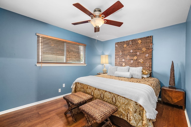 bedroom with hardwood / wood-style flooring and ceiling fan