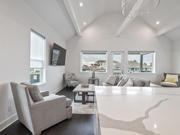 living room featuring dark wood-type flooring and vaulted ceiling with beams