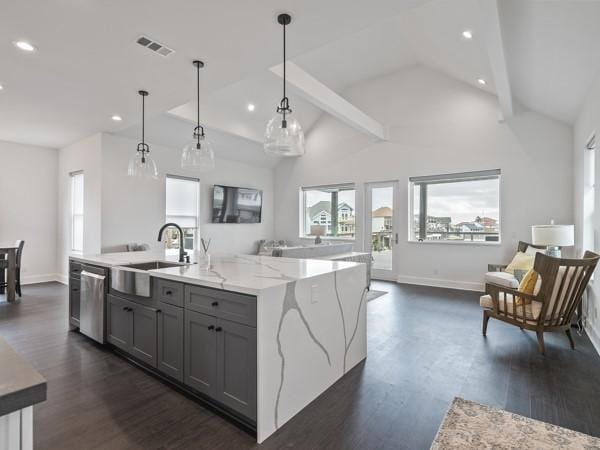 kitchen with dishwasher, a kitchen island with sink, gray cabinetry, pendant lighting, and sink