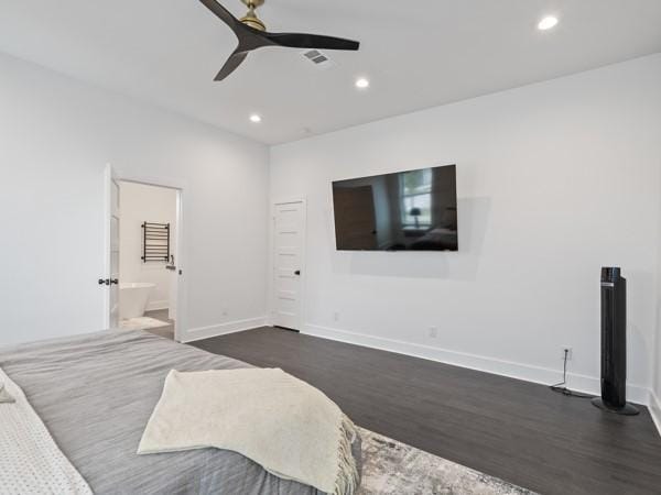 bedroom with ensuite bathroom, ceiling fan, and dark hardwood / wood-style flooring