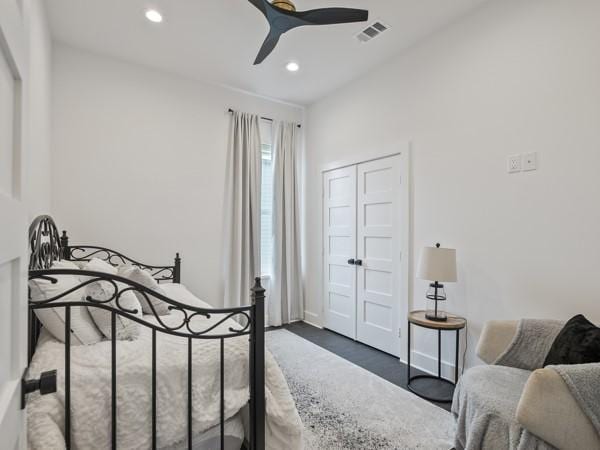 bedroom featuring ceiling fan and a closet