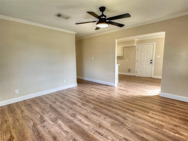 unfurnished room with light hardwood / wood-style floors and ornamental molding