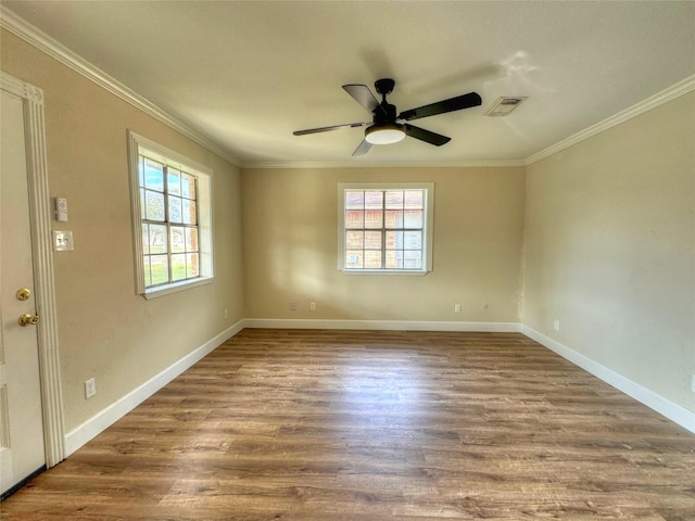 unfurnished room with hardwood / wood-style flooring, ceiling fan, and crown molding