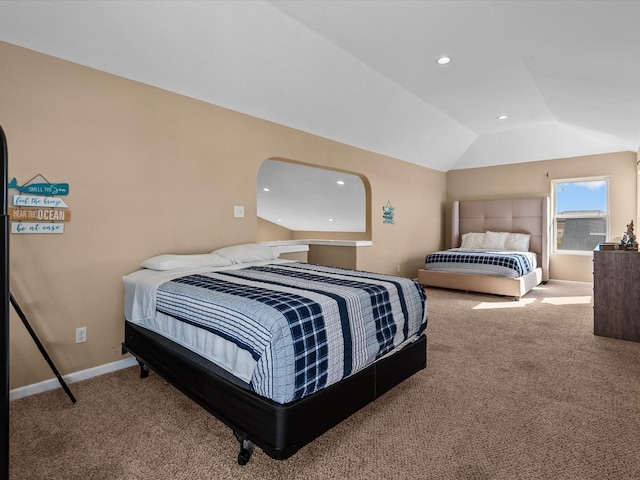 carpeted bedroom with vaulted ceiling