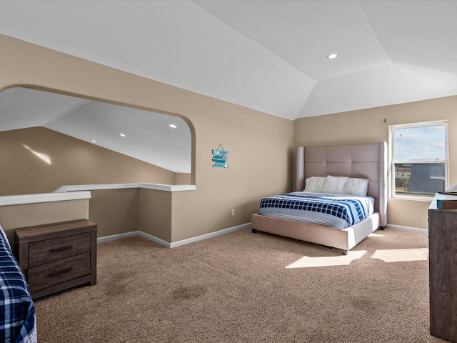 bedroom featuring carpet flooring and lofted ceiling