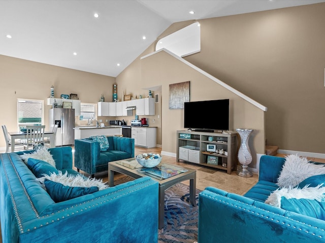 living room featuring high vaulted ceiling