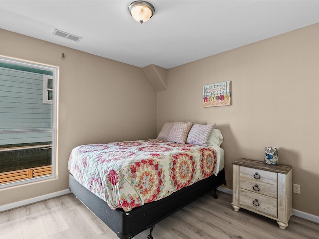 bedroom with light wood-type flooring