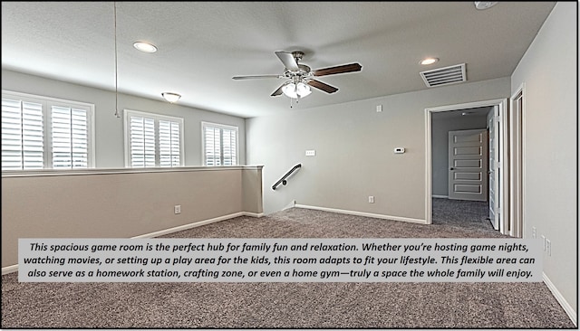 carpeted spare room with ceiling fan and a textured ceiling