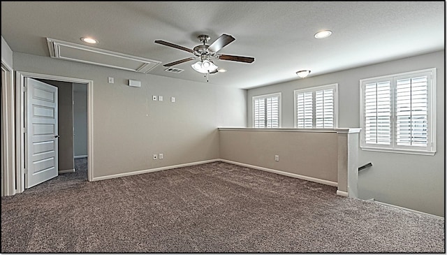 carpeted spare room with ceiling fan and a healthy amount of sunlight