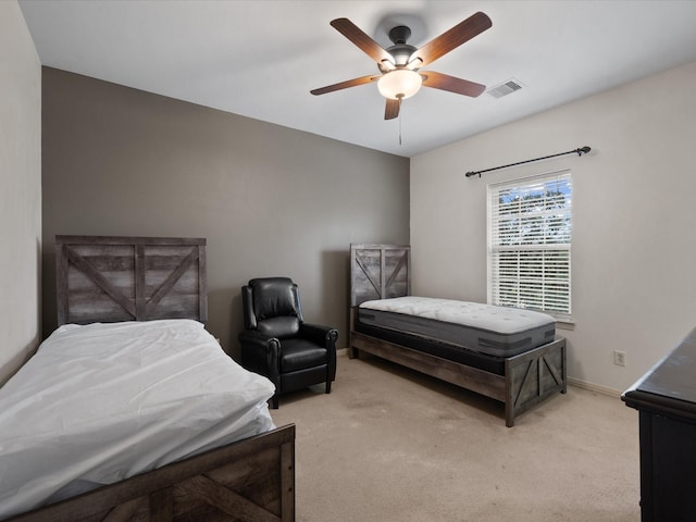 bedroom with light carpet and ceiling fan