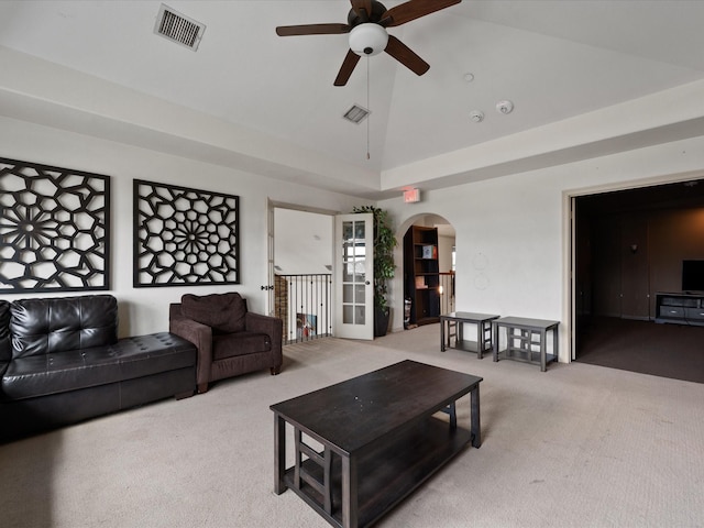 living room with light colored carpet, high vaulted ceiling, and ceiling fan