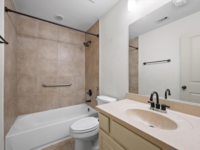 full bathroom with tile patterned flooring, vanity, toilet, and tiled shower / bath combo