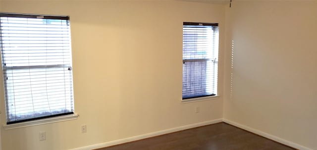 unfurnished room featuring a wealth of natural light