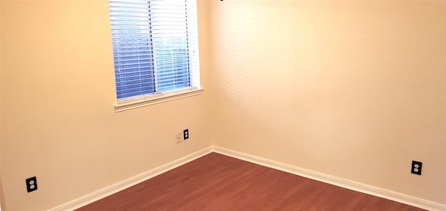 unfurnished room featuring wood-type flooring