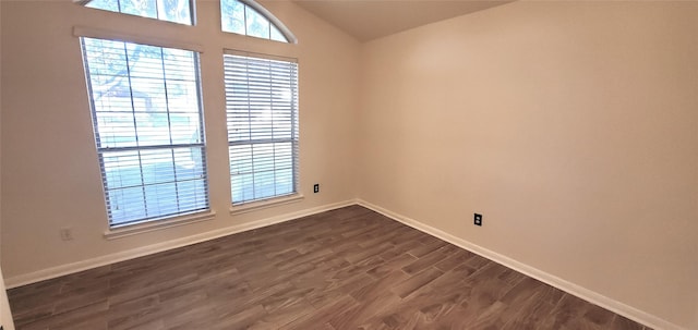 unfurnished room featuring dark hardwood / wood-style flooring