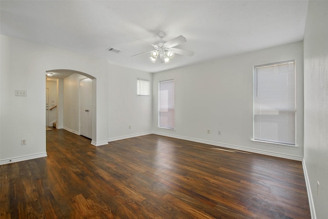 unfurnished room featuring dark hardwood / wood-style flooring and ceiling fan