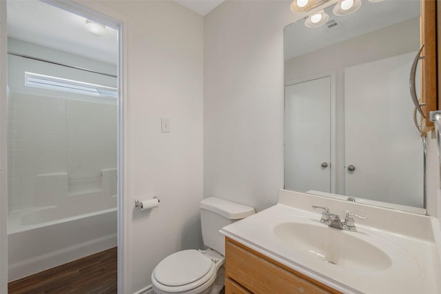 full bathroom featuring shower / washtub combination, toilet, vanity, and hardwood / wood-style flooring