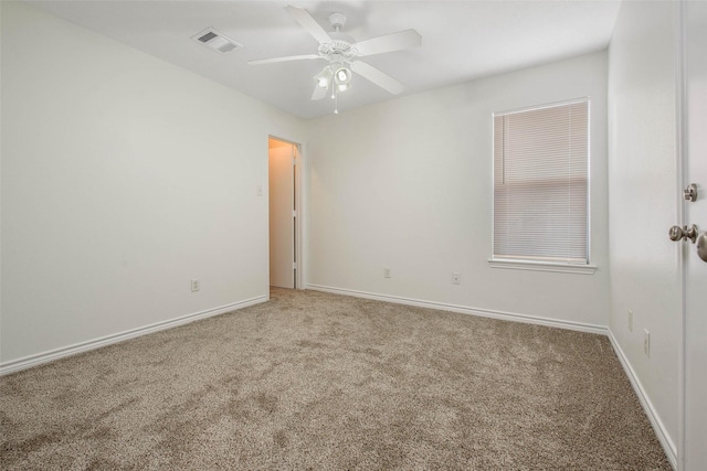 spare room with carpet flooring and ceiling fan