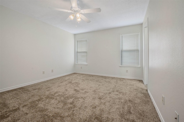 unfurnished room featuring carpet flooring and ceiling fan