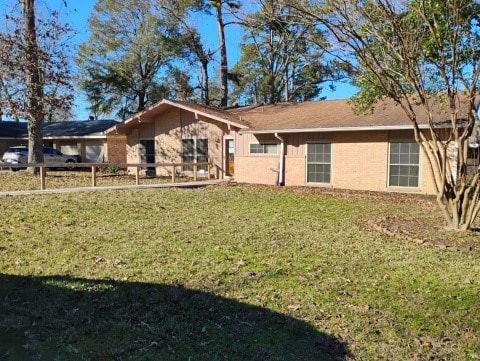 view of front of home with a front yard