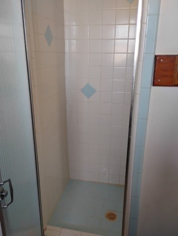 bathroom featuring an enclosed shower