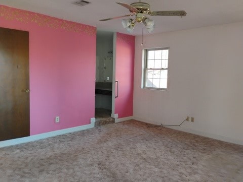 unfurnished bedroom with ceiling fan and carpet