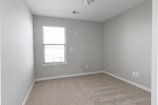 empty room featuring light colored carpet