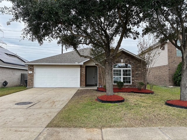 view of front facade featuring a garage and a front lawn