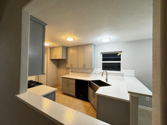 kitchen with kitchen peninsula, sink, gray cabinets, and black dishwasher