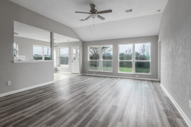 unfurnished living room featuring vaulted ceiling, ceiling fan, and hardwood / wood-style floors